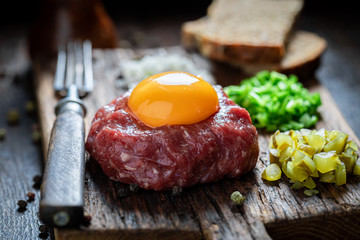 Delicious beef tartare with fresh and healthy ingredients