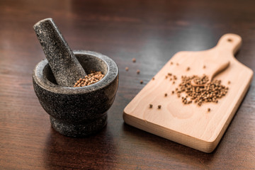 cilantro coriander seeds with granite mortar