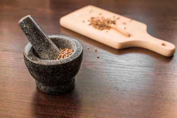 cilantro coriander seeds with granite mortar
