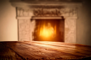 Desk of free space and home interior with fireplace 