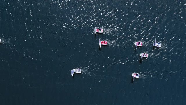 Top view of sailing boats on lake during the competition