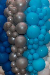 background of many white, blue, gray balloons. Blue and gray balloons on the birthday party