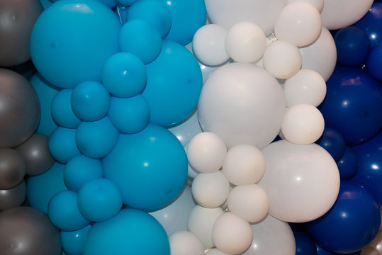 background of many white, blue, gray balloons. Blue and gray balloons on the birthday party