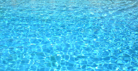 Azur blue water in a pool. Use as a background or backdrop for your graphics.