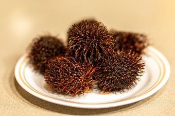 Rambutan tropical fruit.The rambutan is sweet and juicy fruit. Native to southeast Asia,largest producer is Thailand. Detail.Work with shallow depth of field