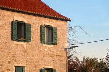 Fototapeta na wymiar Colorful rustic window on a Mediterranean style building in Split, Croatia.