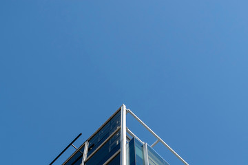 Fototapeta na wymiar Simetrical shot of a building architecture on a blue sky