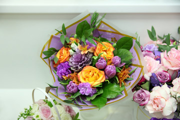 Purple tulips, carnations, yellow roses, a beautiful bouquet of flowers
