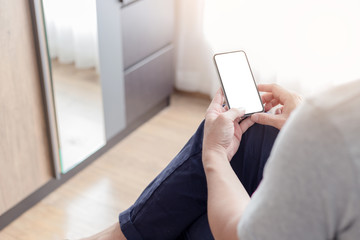 Mockup image blank white screen cell phone.man hand holding texting using mobile.background empty space for advertise text.people contact marketing business,technology 