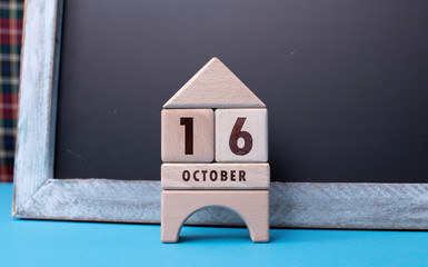 October 16 written with wooden blocks