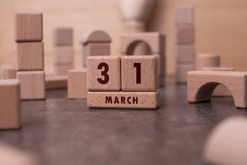 March 31 written with wooden blocks