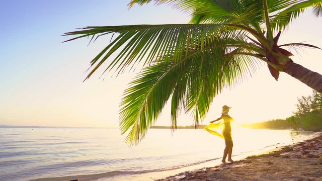 Sunrise over tropical island beach and palm trees. Punta Cana, Dominican Republic.