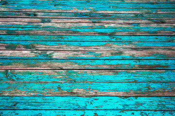 old wood background. rustic weathered barn wooden background with knots and holes for nails, traces of remains of old paint on wooden surface. Large cracks