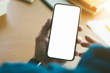 Mockup image blank white screen cell phone.man hand holding texting using mobile.background empty space for advertise text.people contact marketing business,technology 