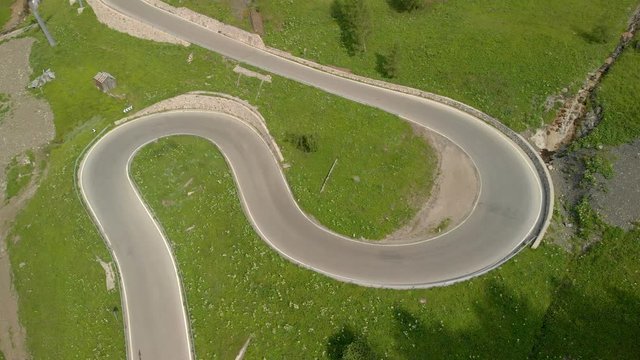 Road In Mountains With Hairpin Curves Which Looks Like A Race Track, Aerial View 4k Flying Around