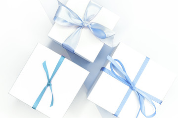 gift box with blue ribbon on white background