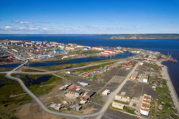 Aerial view of Tavayvaam village (on the right) and Anadyr city (on the left behind the Kazachka river). Chukotka settlements in the far north of Russia. Anadyr estuary and vast expanses of Siberia.