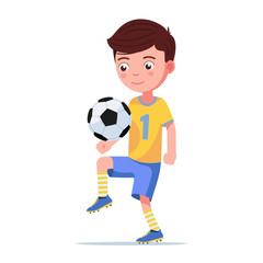 Boy football player kicks the ball