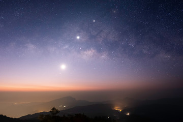 Fototapeta na wymiar Observers at night have stars, milky way and galaxies filled the dark sky.