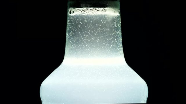 Foaming from drinks in bottles On a black background