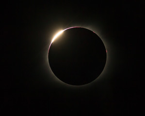 Red baileys beads peek out during Eclipse 2017