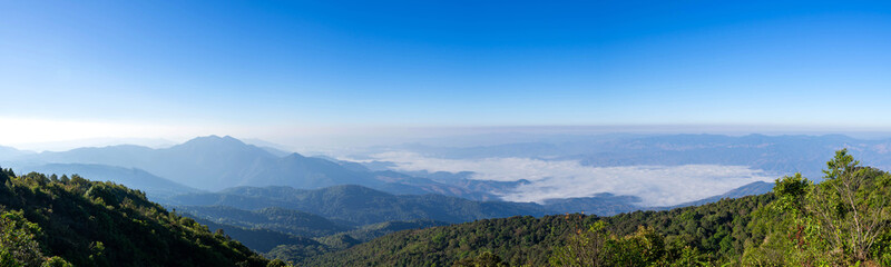 Naklejka premium beautiful panoramic mountain and mist on blue sky background , at north thailand inthanon national park , Chiang Mai province , panorama landscape Thailand
