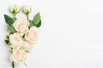Beautiful white roses bouquet on white background with copy space