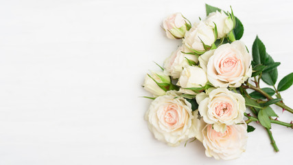 Fototapeta na wymiar Beautiful white roses bouquet on white background with copy space