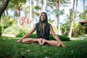Man practice Yoga practice and meditation outdoor