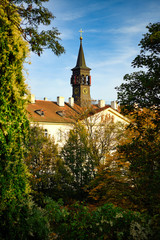 Church in Prague, Praha, Czech Republic. The foreground is a tree changing color in autumn.