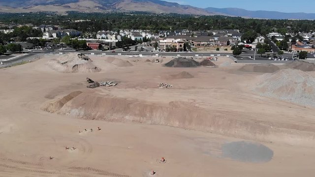 Fly over construction site and cleared ground hills of dirt Reno NV plumb lane virginia