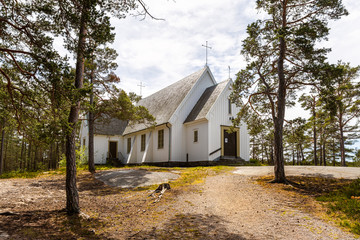 The chapel in Sandhamn out in Stockholm archipelago surrounded by a pine forest.
