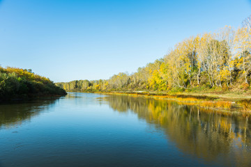 Beautiful river in sunshiny morning. Autumn landscape.