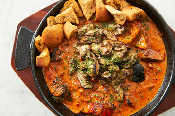 Grilled oyster with tomato sauce 