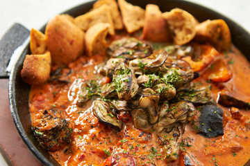 Grilled oyster with tomato sauce 