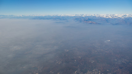Aerial view of the smog and fog that covers the Po Valley in Italy.  Landscape from airplane...