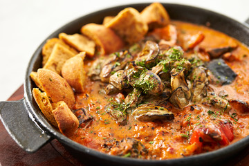 Grilled oyster with tomato sauce 