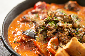 Grilled oyster with tomato sauce 