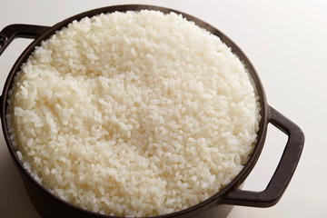 Cooked rice in pot, studio shot 