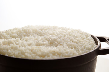Cooked rice in pot, studio shot 