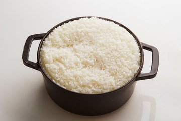 Cooked rice in pot, studio shot 