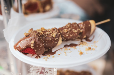 Banana dessert with chocolate in a plate