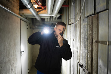 Security Guard Standing In The Basement