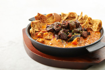 Beef steak with tomato sauce and bread 