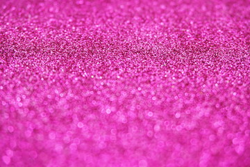Abstract defocused shiny sparkle pink glitter bokeh background