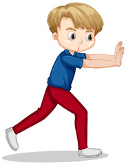 Boy in blue shirt pushing wall