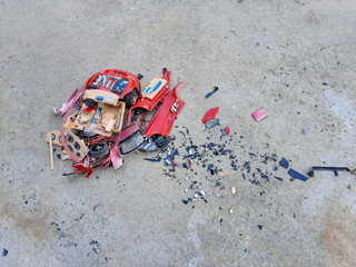 Fototapeta na wymiar Car toy has accident hit and broken on the road