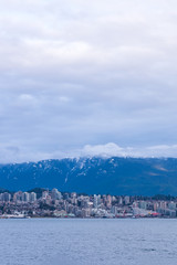 Naklejka premium View on Vancouver Downtown and Mountains over ocean. British Columbia. Canada.