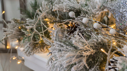 composition of Christmas decorations with fir tree and garlands. the sparkling lights