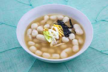 Korean style rice cake soup which is called Jolaeng-i Ddukkuk eats on the Lunar moon new year